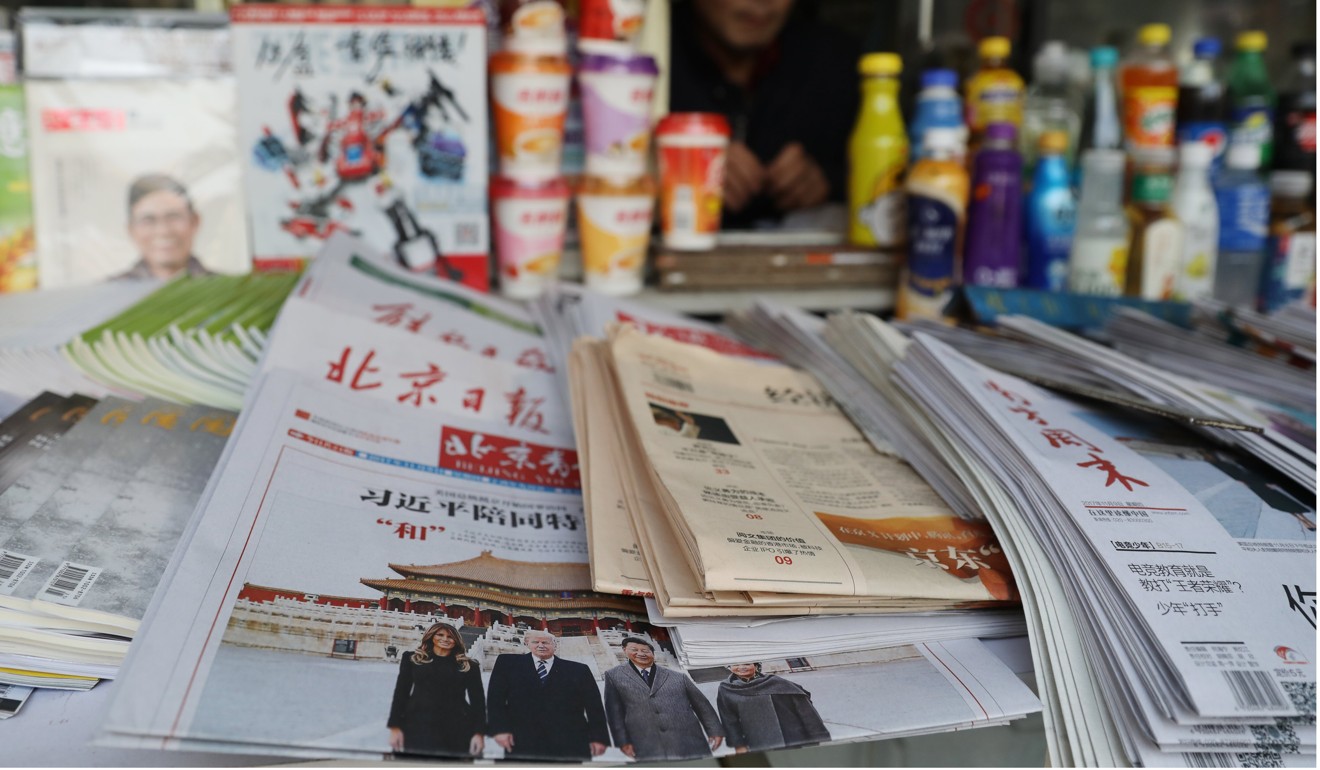 Chinese newspapers are displayed at a news stand in Beijing on November 9, during the time of US President Donald Trump’s visit. Chinese people believe that the media reports only that which the government approves. Photo: EPA-EFE
