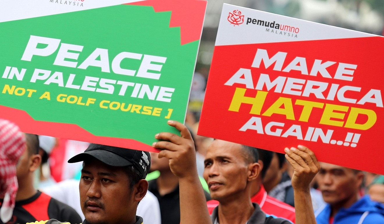 Malaysian Muslims hold placards during a demonstration in Kuala Lumpur. Photo: AFP