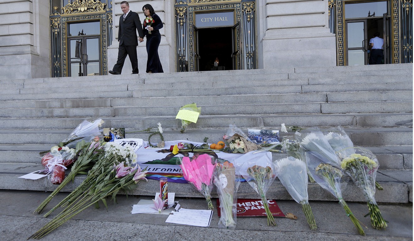 Flowers and signs left for Mayor Ed Lee on the steps of City Hall in San Francisco. Photo: AP