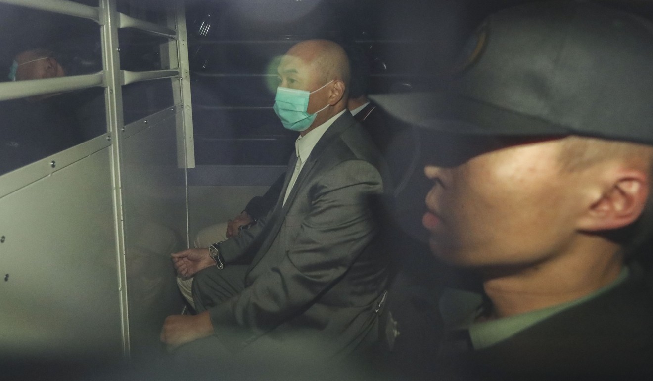 Dr Stephen Chow Heung-wing (left) is escorted by police from the High Court to Lai Chi Kok Reception Centre on Tuesday. Photo: Sam Tsang