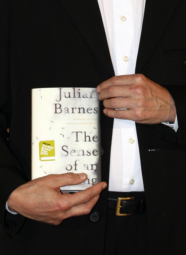 Barnes with his Man Booker Prize-winning book, The Sense of an Ending. Picture: Reuters