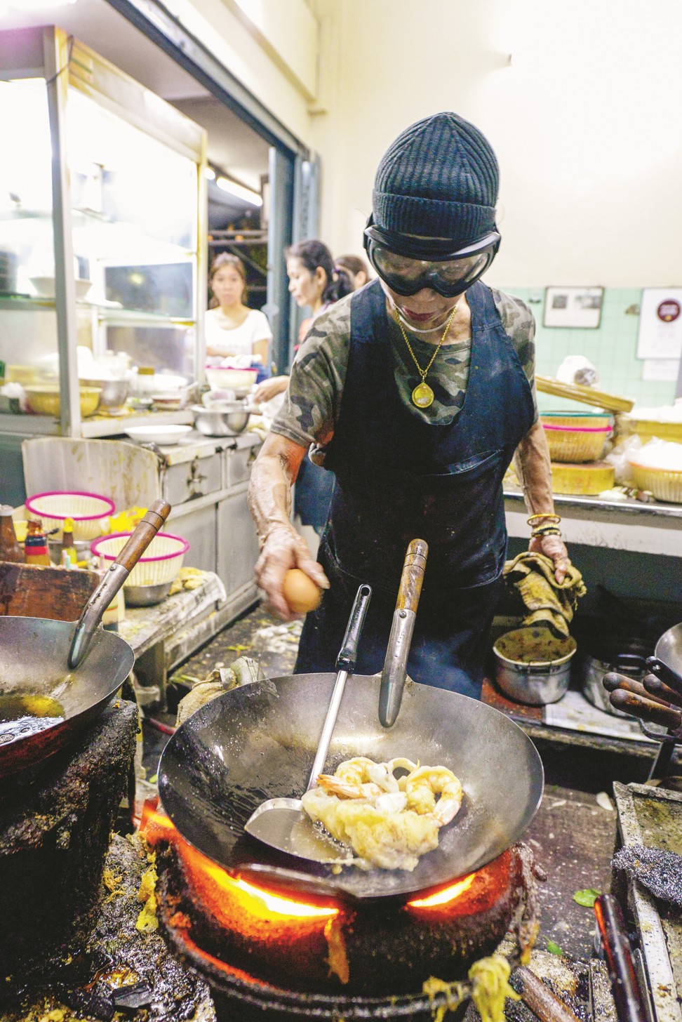 Fai cooking at her restaurant in Bangkok’s Chinatown. Photo: Mason Florence