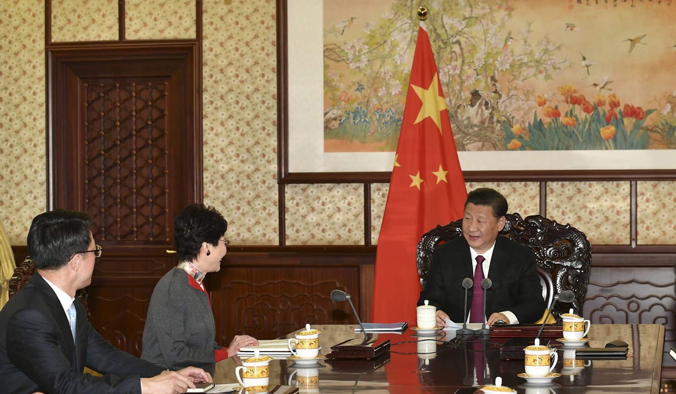 Lam (second from left) briefed Xi on the latest economic, social and political developments in Hong Kong. Photo: ISD