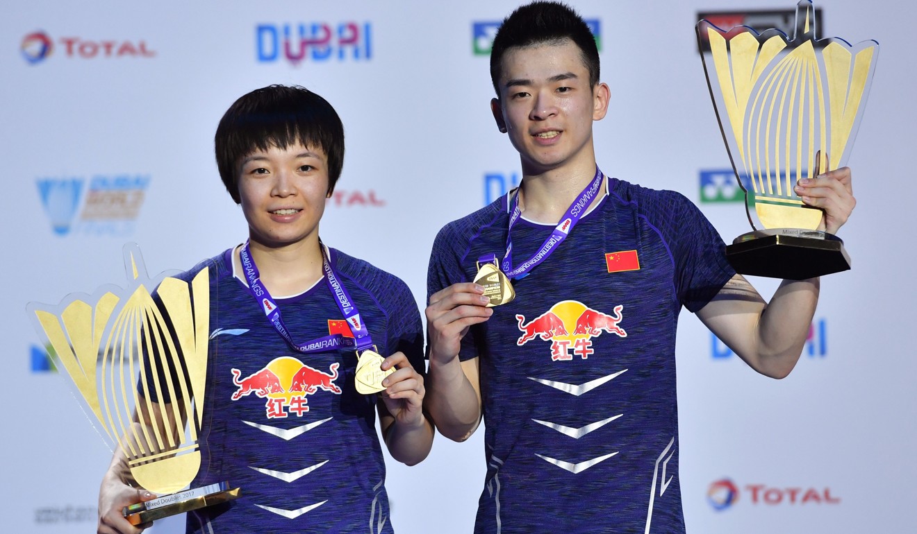 Chen Qingchen and Zheng Siwei show off their silverware. Photo: AFP