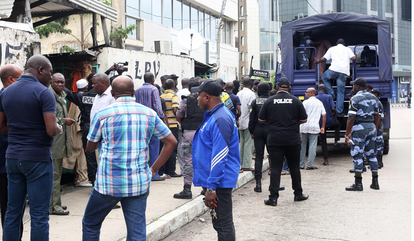 Police officers at the market in Libreville. Photo: AFP