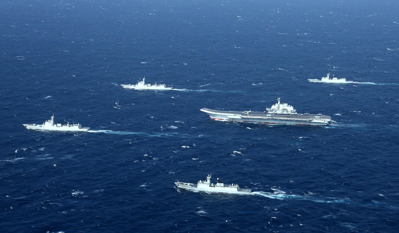 A Chinese navy formation, including the aircraft carrier Liaoning, conducts military drills in the South China Sea. Photo: AFP