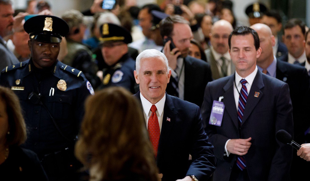 US Vice-President Mike Pence (centre) is seen before a Senate vote on the tax bill. Photo: Xinhua