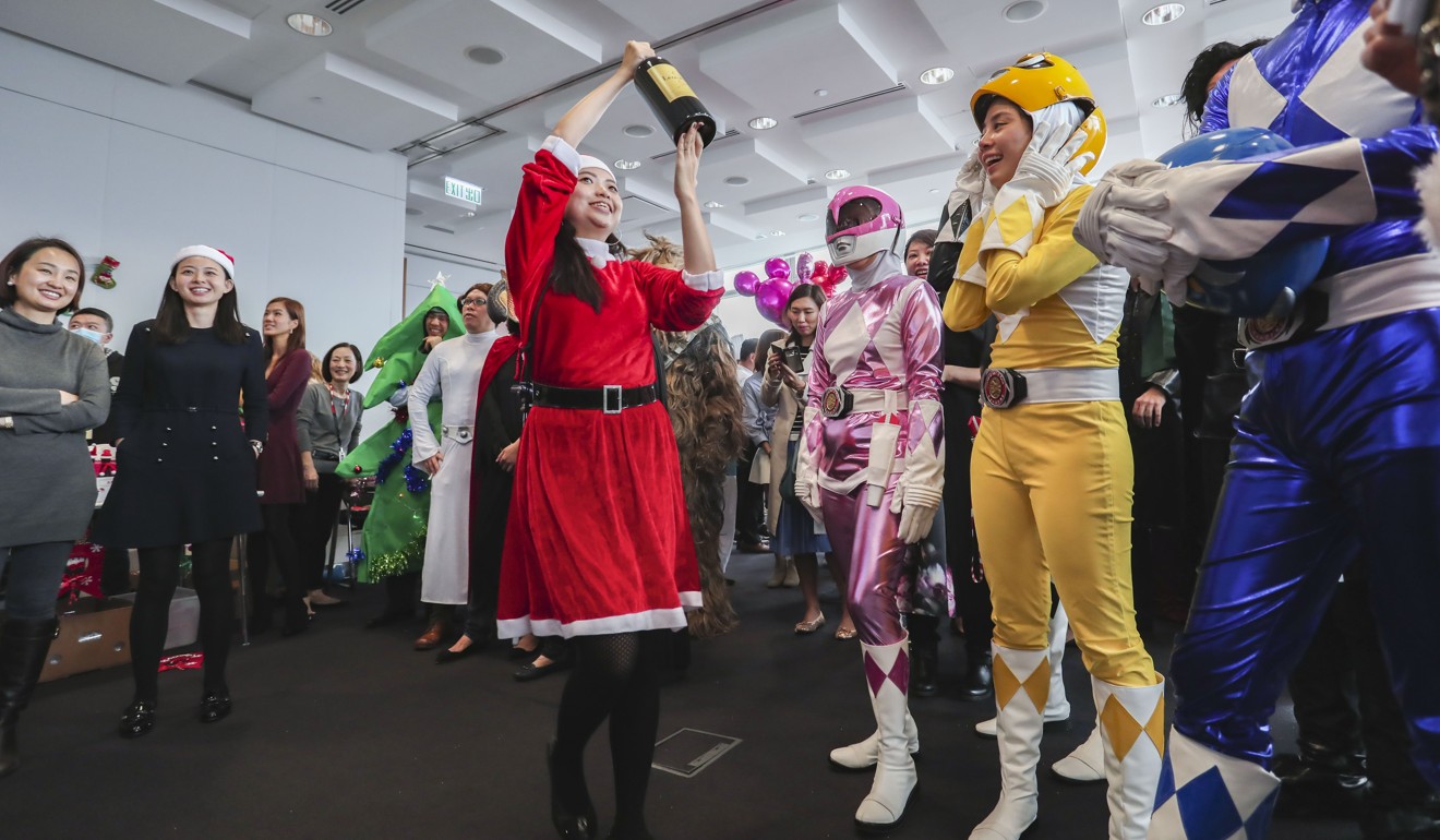 Costumed party-goers have great fun in what is a December highlight for staff. Photo: Jonathan Wong