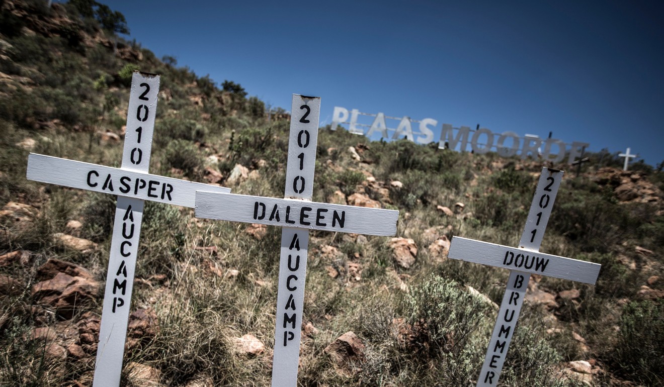 Crosses are planted on a hillside at the White Cross Monument, each one marking a white farmer who has been killed in a farm murder. Photo: AFP