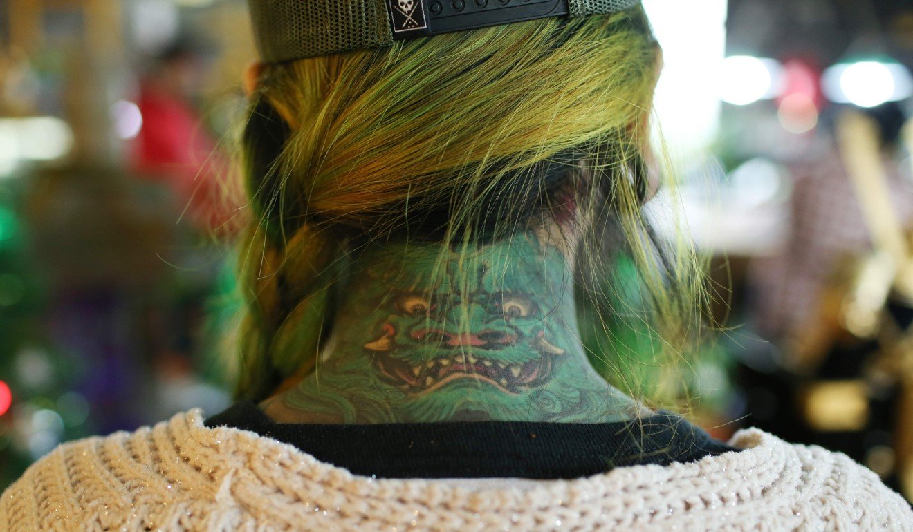 A tattoo displayed on the neck of a tattoo artist at a studio in Shanghai. Photo: Agence France-Presse