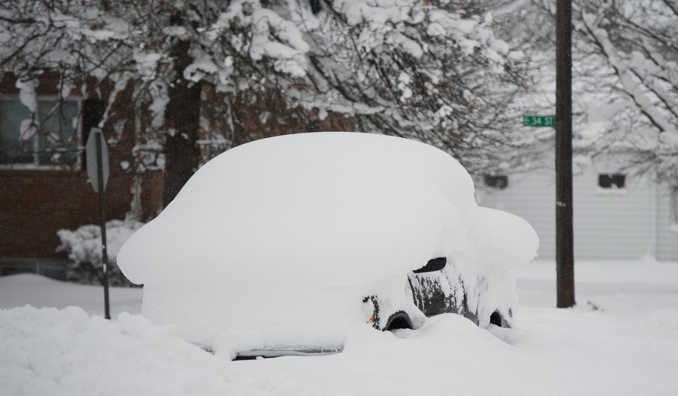 A pickup truck is covered with snow in Erie, Pennsylvania, on Wednesday. Photo: Reuters