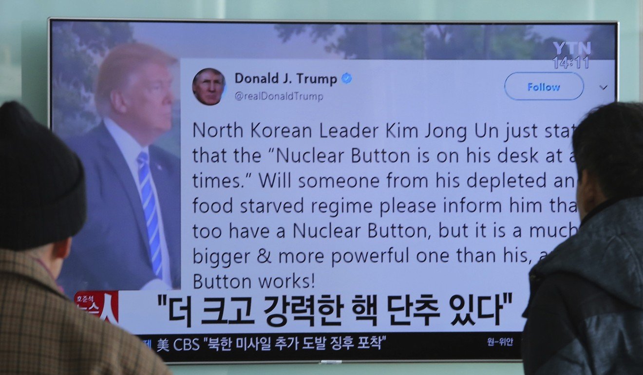 People watch a television news programme showing Donald Trump’s Twitter post about having a ‘bigger nuclear in Seoul, South Korea. on Wednesday. Photo: AFP