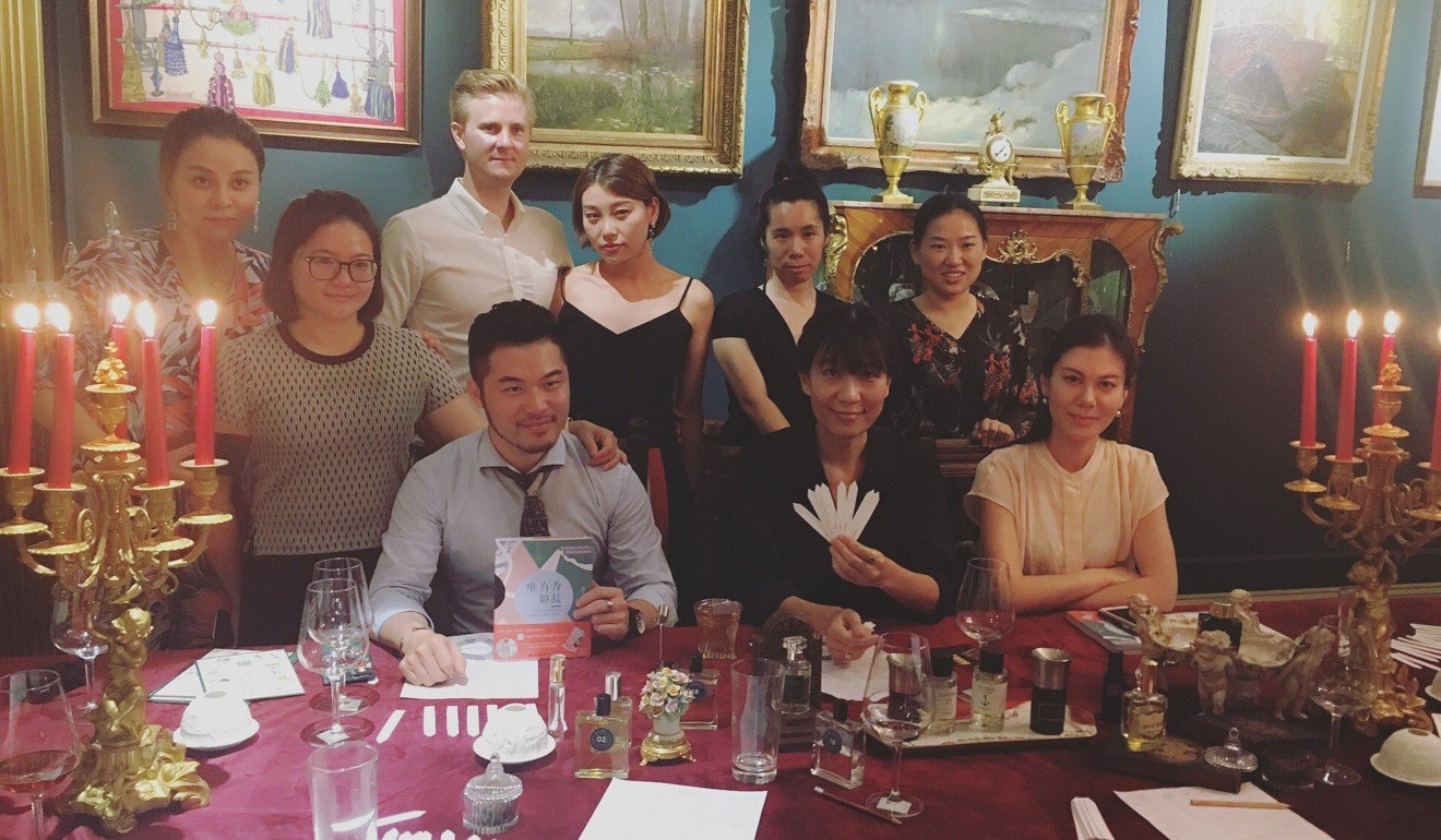 Cai (seated left) with some of his clients at Minorité in Shanghai.