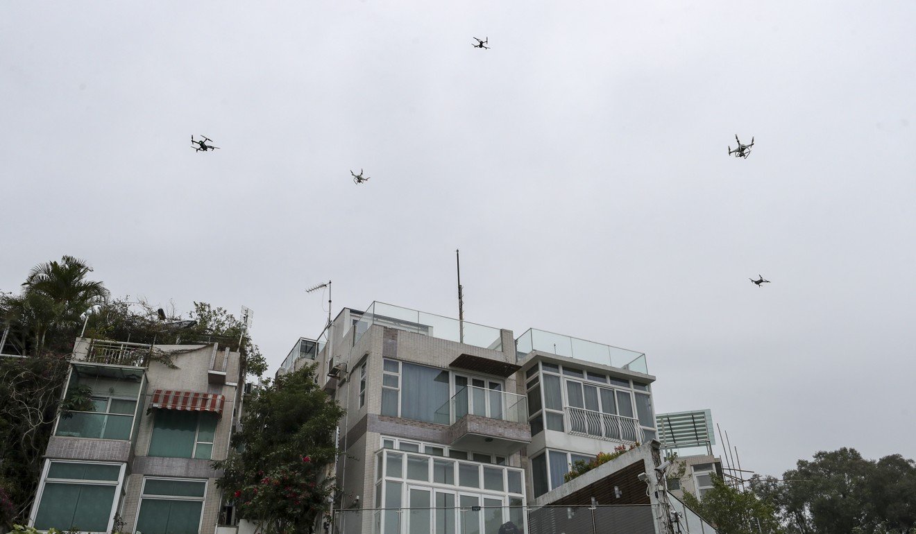 Media drones over the house of Teresa Cheng Yeuk-wah in Tuen Mun on Tuesday. Photo: Winson Wong