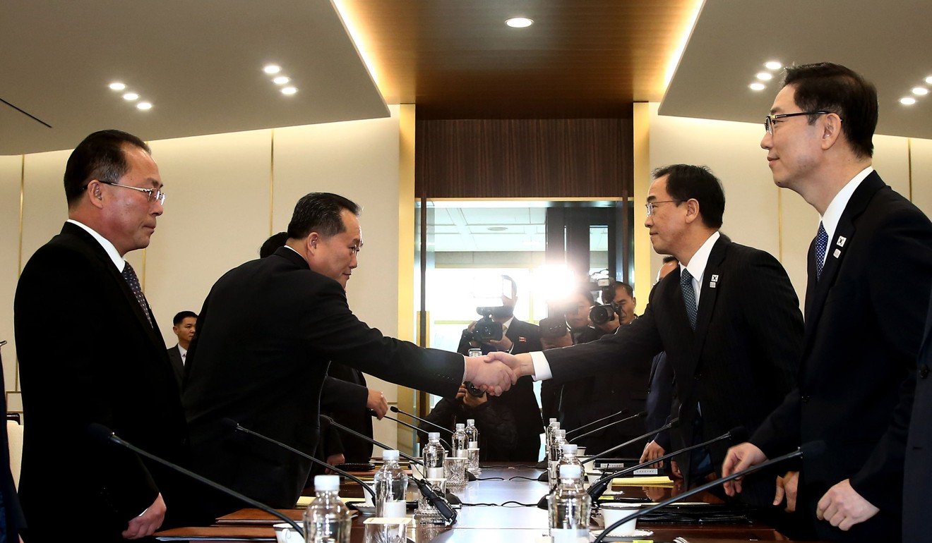 South Korea Unification Minister Cho Myung-gyun (second right) shakes hands with North Korean chief delegate Ri Son-gwon (second left) during their meeting at the border truce village of Panmunjeom in the demilitarised zone on Tuesday. Photo: Agence France-Presse