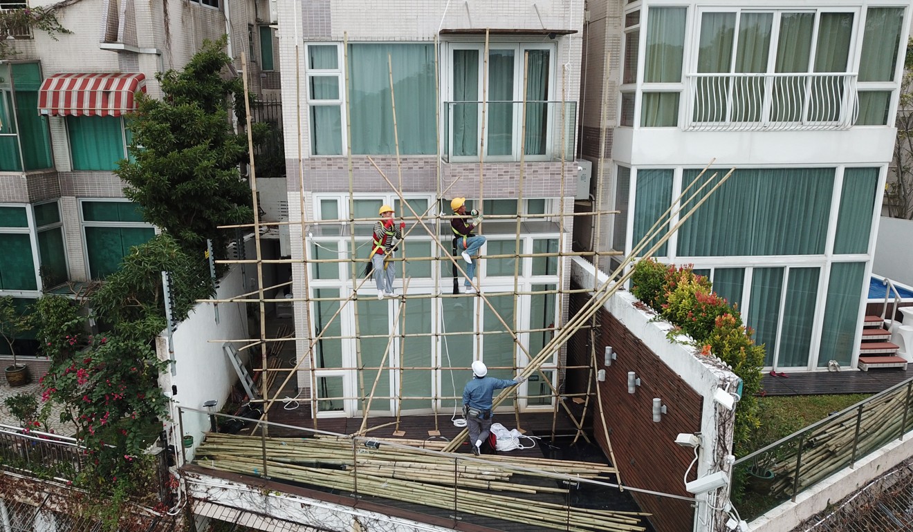 Workers spotted outside Teresa Cheng’s house on Wednesday afternoon putting up scaffolding. Photo: Winson Wong