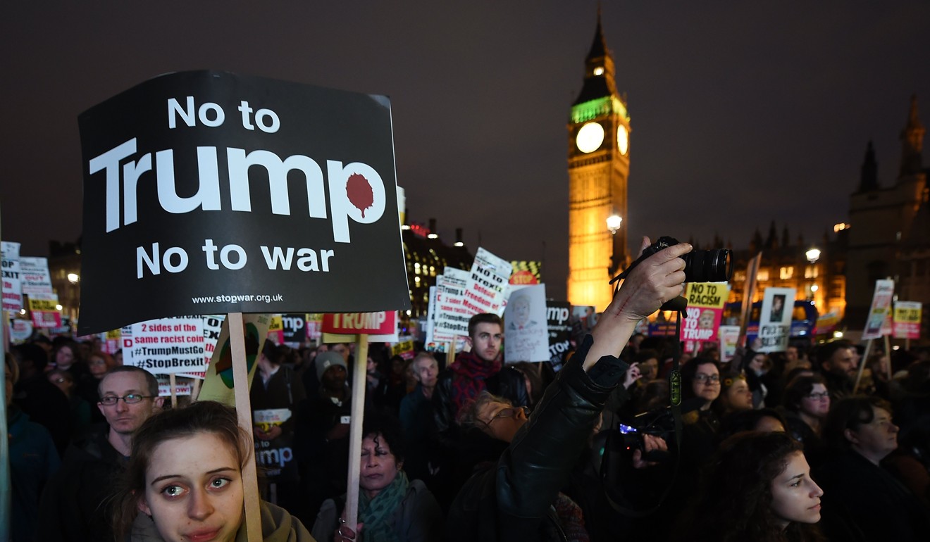 File photo of people protesting against the proposed state visit to Britain by US President Donald Trump, in London, Photo: EPA