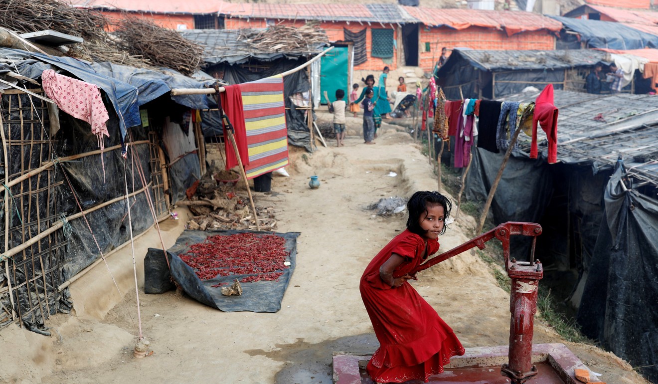 A Rohingya refugee girl plays at a well in Palong Khali camp, near Cox's Bazar, Bangladesh. Photo: Reuters