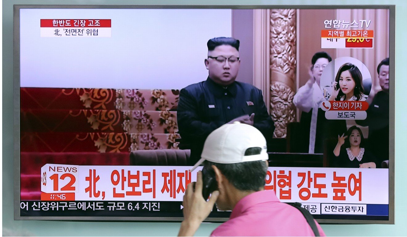 A South Korean man walks by a TV screen showing North Korean leader Kim Jong-un. South Korean optimism over the prospects for unification, common after the first inter-Korean summit in 2000, have diminished in recent years, with young people in particular saying they do not consider reunification desirable. Photo: AP
