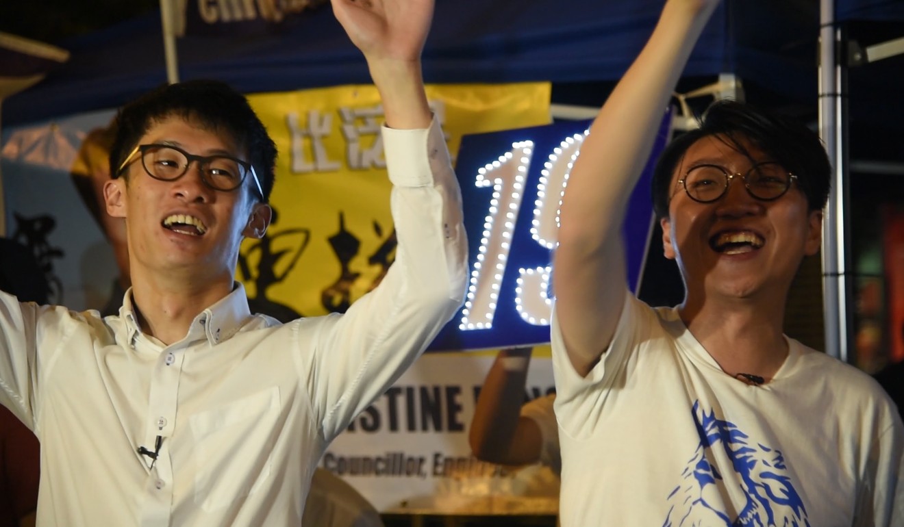 Sixtus “Baggio” Leung and Edward Leung speak to the crowd during a political rally.