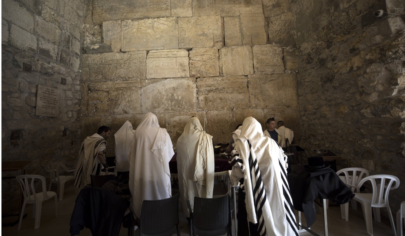 Israeli Jews pray at the Western Wall in Jerusalem’s old city on Monday. Photo: EPA