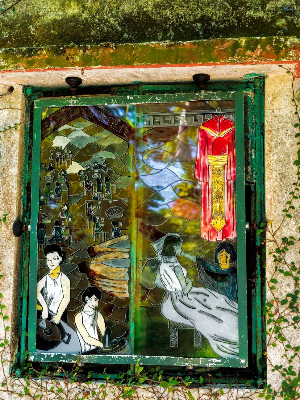 A stained-glass window of a house in Yim Tin Tsai showing wedding preparations. Photo: Martin Williams