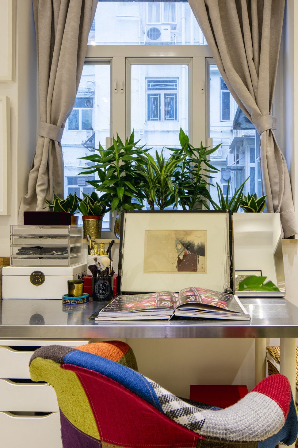 A colourful chair adds drama to a quiet corner.