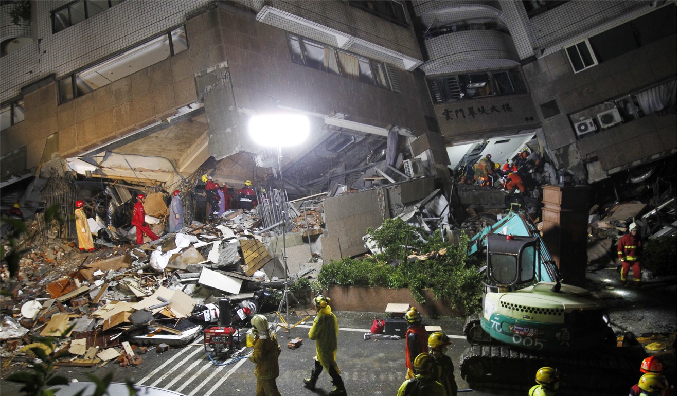 Rescuers work on a search operation at an apartment building collapsed after a strong earthquake in Hualien County, eastern Taiwan, on Wednesday. A magnitude 6.4 earthquake struck late Tuesday night caused several buildings to cave in and tilt dangerously. Photo: AP