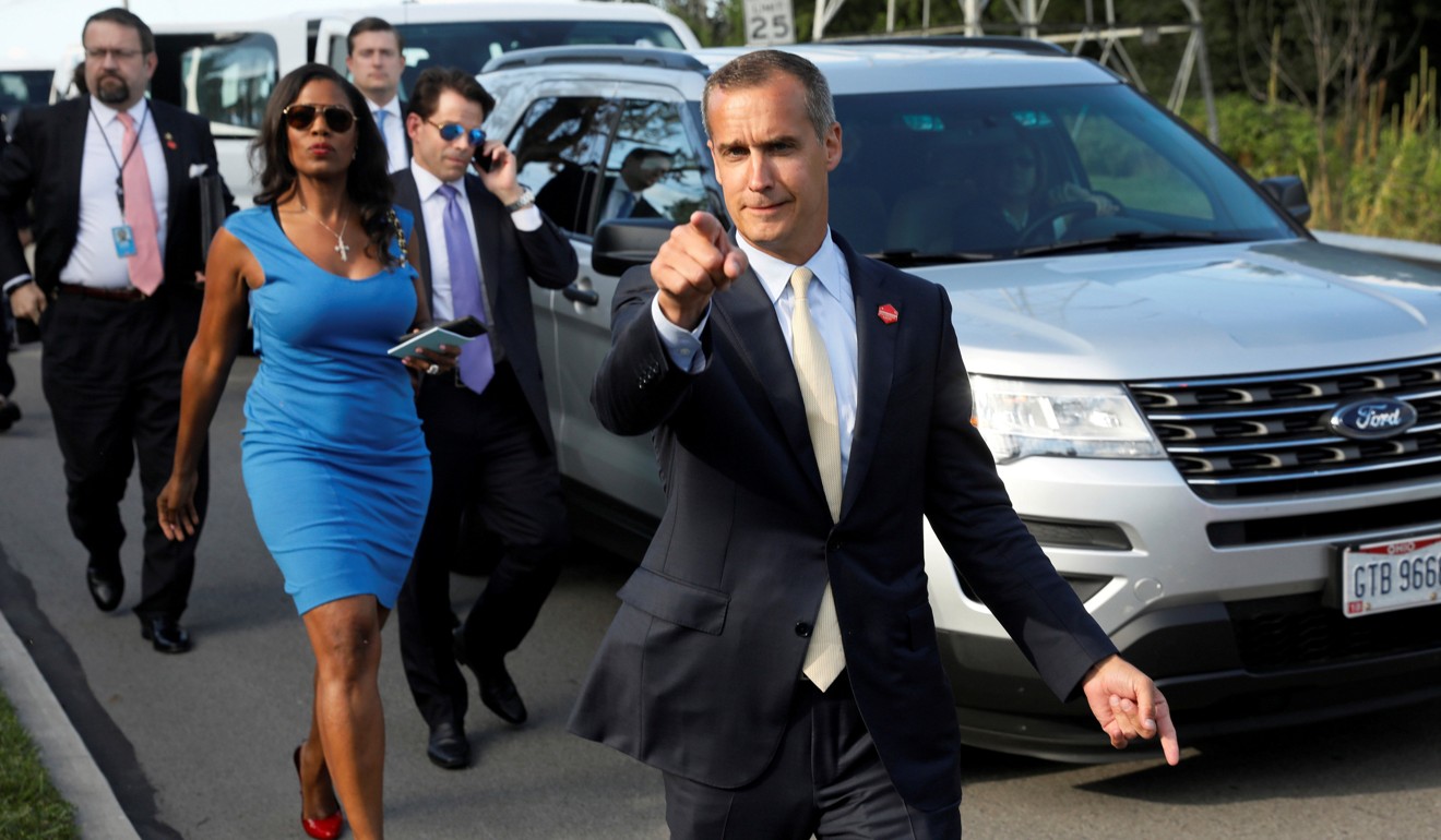 Former campaign manager Trump Corey Lewandowski (C) says hello to reporters as he and White House advisers (from left) Sebastian Gorka, Omarosa Manigault, White House Staff Secretary Rob Porter and Communications Director Anthony Scaramucci accompany President Trump for an event celebrating veterans in Struthers, Ohio, on July 25, 2017. All have left the White House. Photo: Reuters