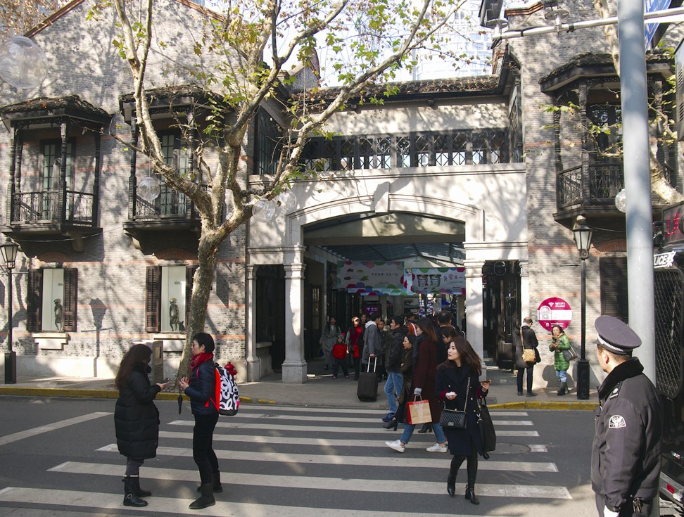 Shoppers enjoy the historic architecture of Xintiandi in Shanghai. Photo: Stuart Heaver