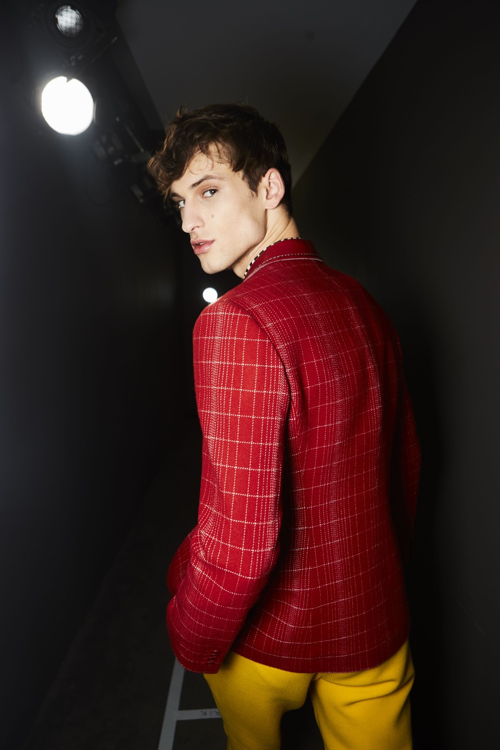 A male model backstage at the Bottega Veneta show.