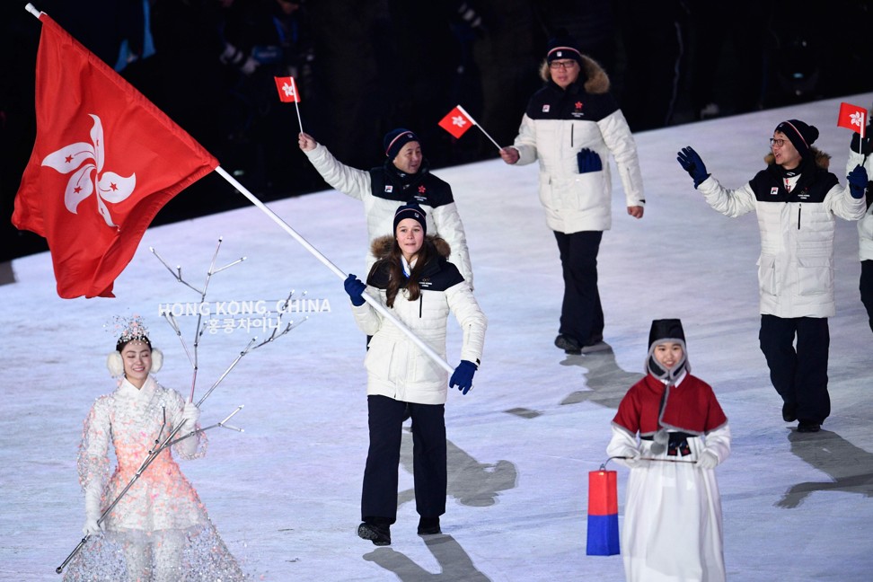 Hong Kong’s flag bearer Arabella Ng leads the delegation parade during the opening ceremony. Photo: AFP