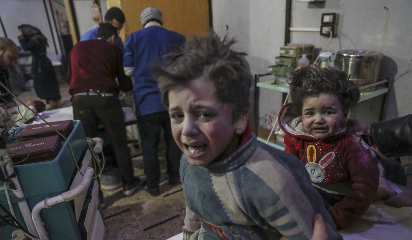 Injured children are treated at a hospital in rebel-held Douma, Eastern Ghouta, Syria, on Monday. Photo: EPA