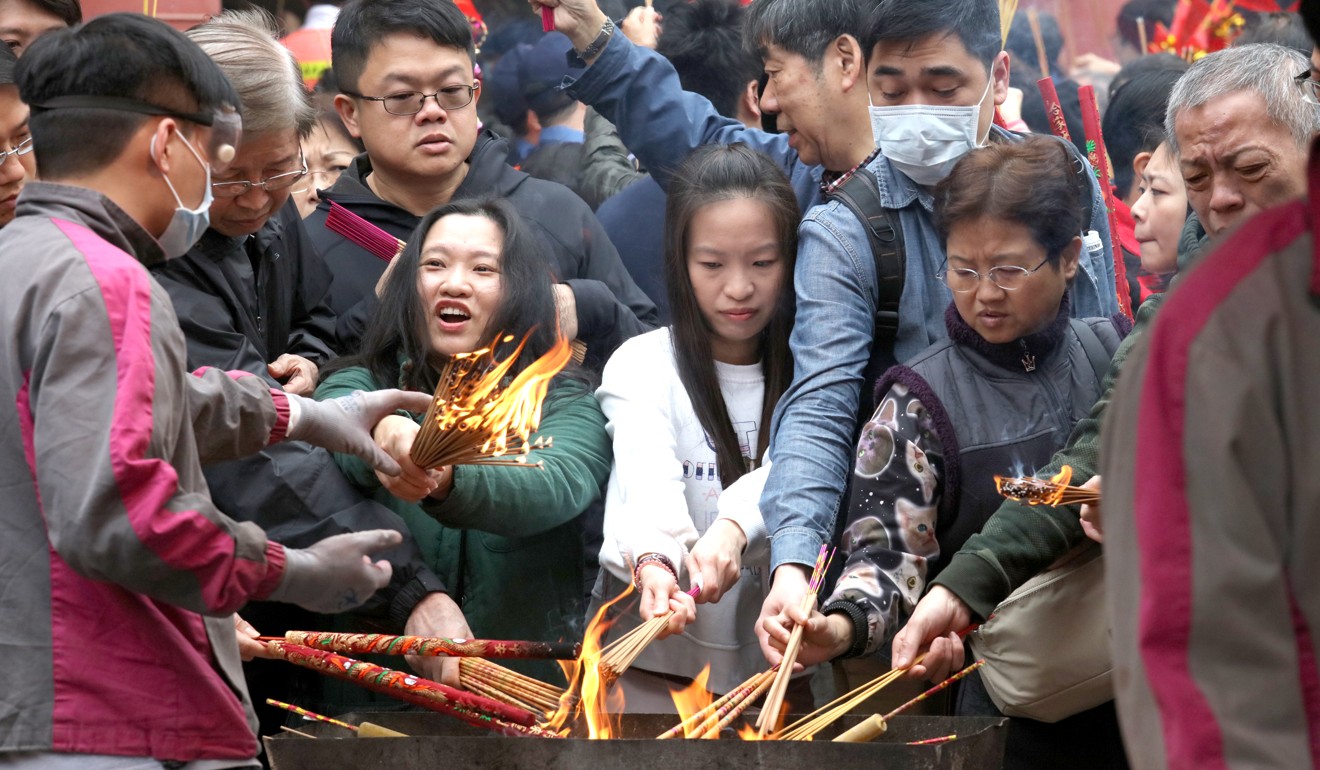 Worshippers visit Che Kung Temple in Sha Tin to pray for good luck and prosperity in the Year of the Dog on the third day of the Lunar New Year. Photo: Felix Wong