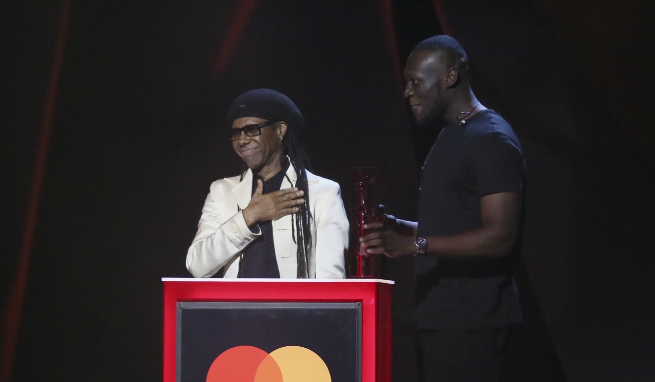 Nile Rodgers presents Stormzy with the award for Best British Album at the Brit Awards 2018 in London. Photo: AP