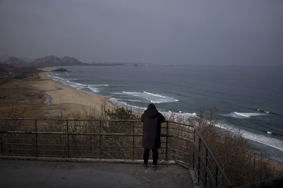 Park Range leans on a rail while viewing North Korea from the Goseong Unification Observatory. Photo: AP