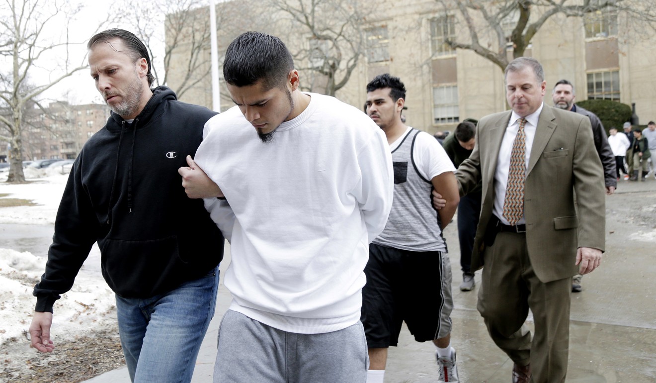 Suspected members of the MS-13 gang are escorted to their arraignment in Mineola, New York, in January. File photo: AP