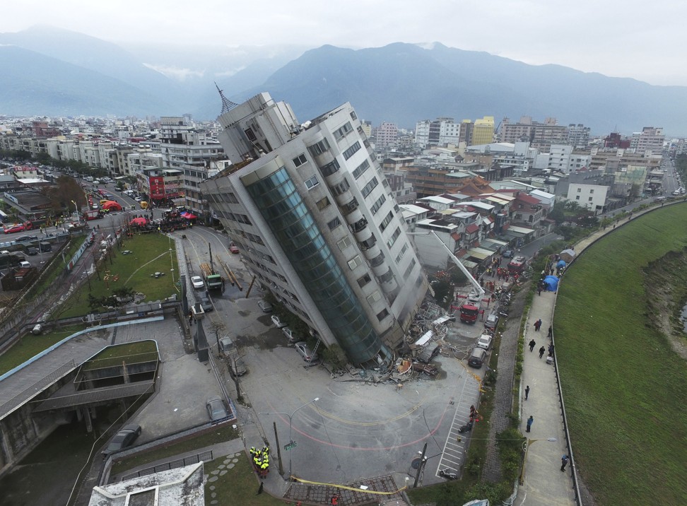 The couple had been named among the dead but their bodies remained in the 12-storey Yun Tsui building, which was left leaning at about a 50-degree angle by the quake, complicating rescue efforts. Photo: AP