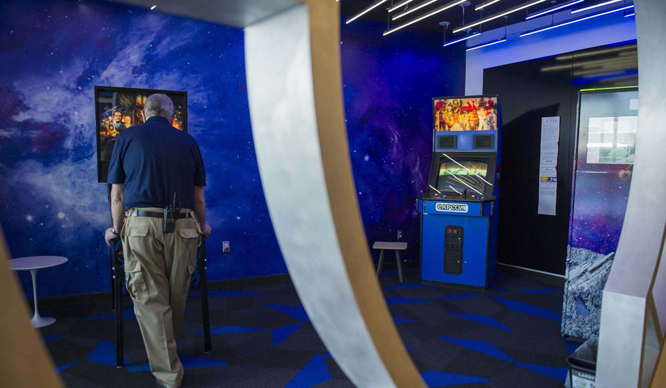 An employee plays a pinball machine at the Google campus. Photo: Bloomberg
