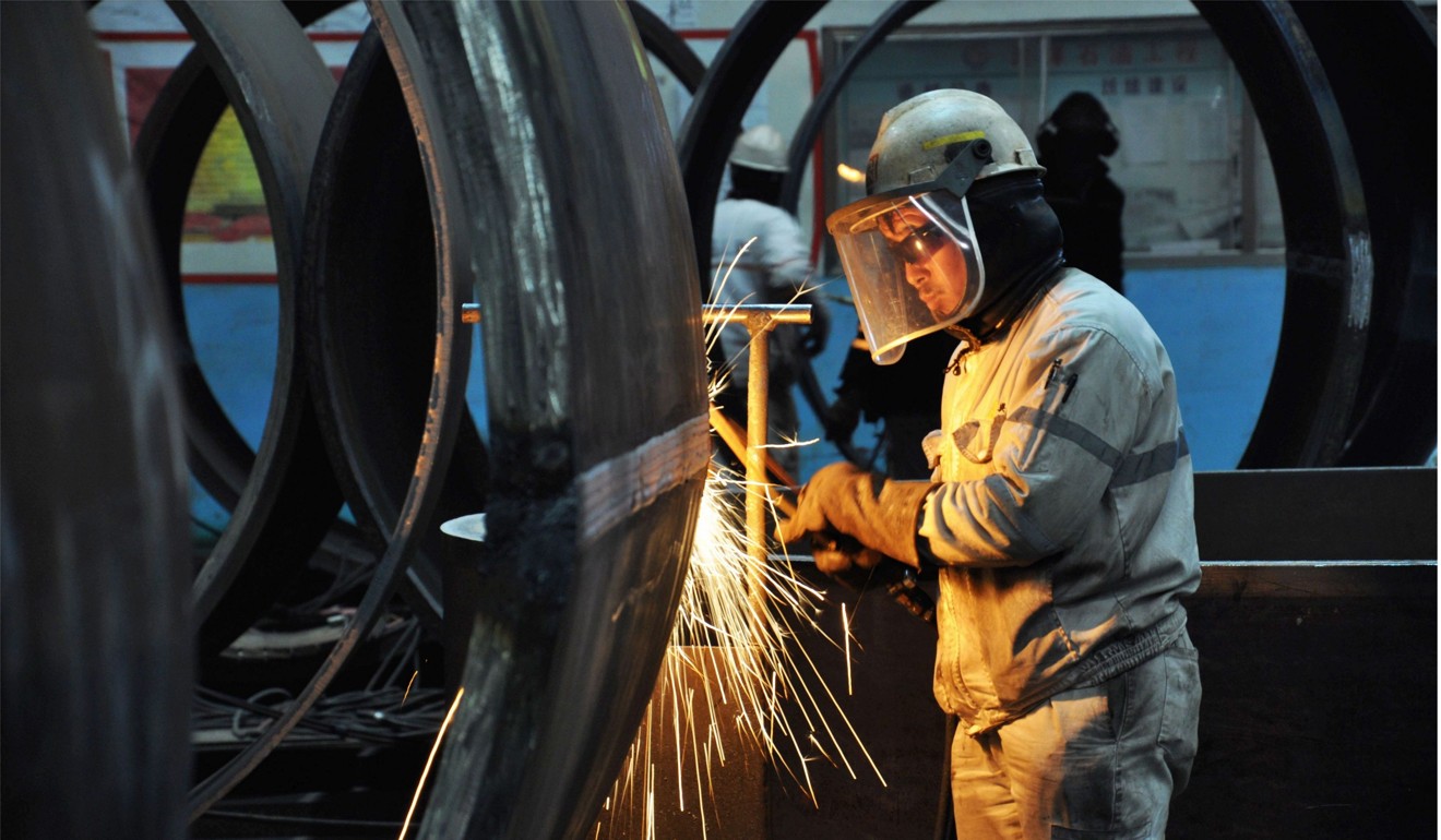 A Chinese worker cuts steel in Qingdao in China's eastern Shandong province. Photo: AFP