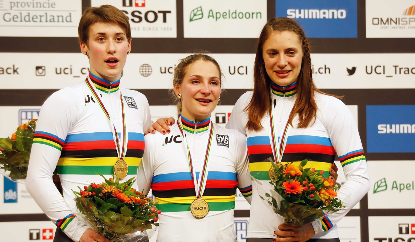 Kristina Vogel (centre), Sophie Grabosch (left) and Miriam Welte of Germany celebrate on the podium after winning the team sprint at the UCI Track Cycling World Championships in Apeldoorn, Netherlands. Photo: EPA