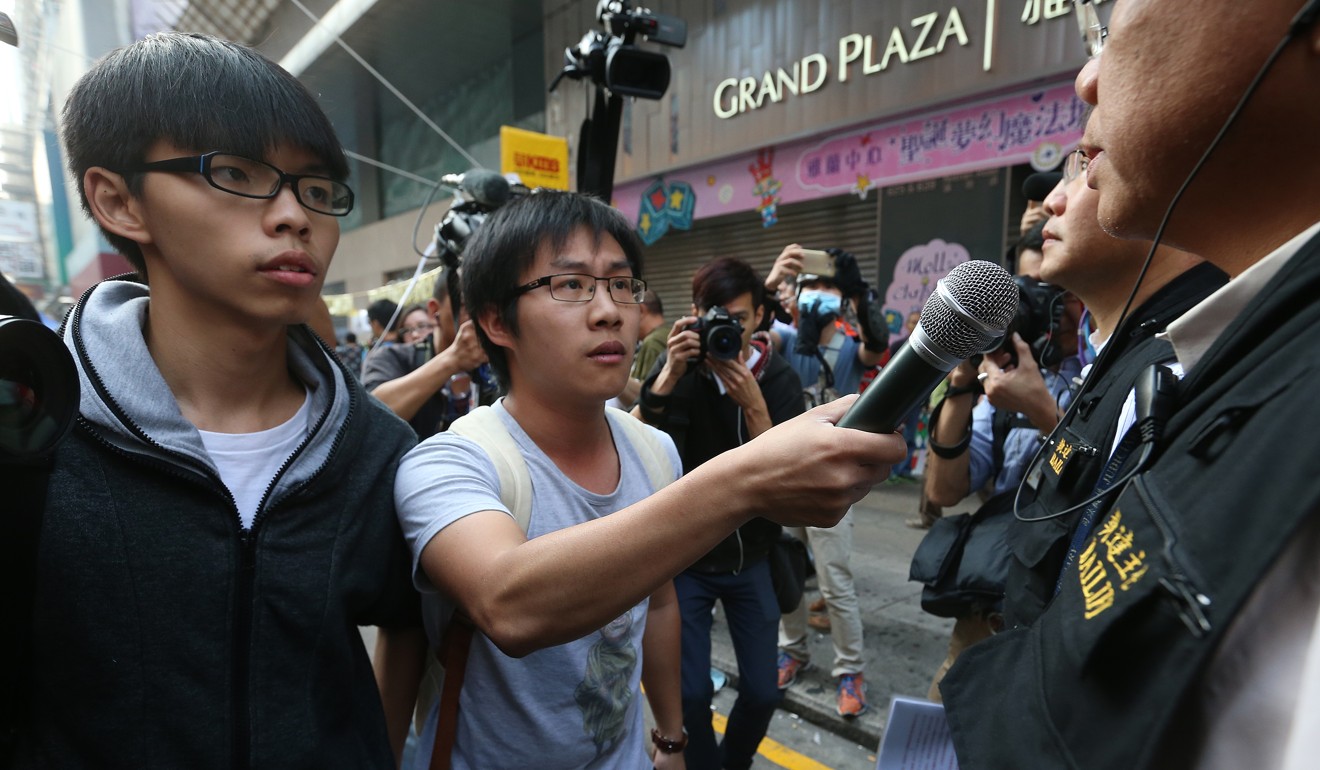 Raphael Wong, right, and Joshua Wong during a clearance operation in Mong Kok in 2014. Photo: K.Y. Cheng