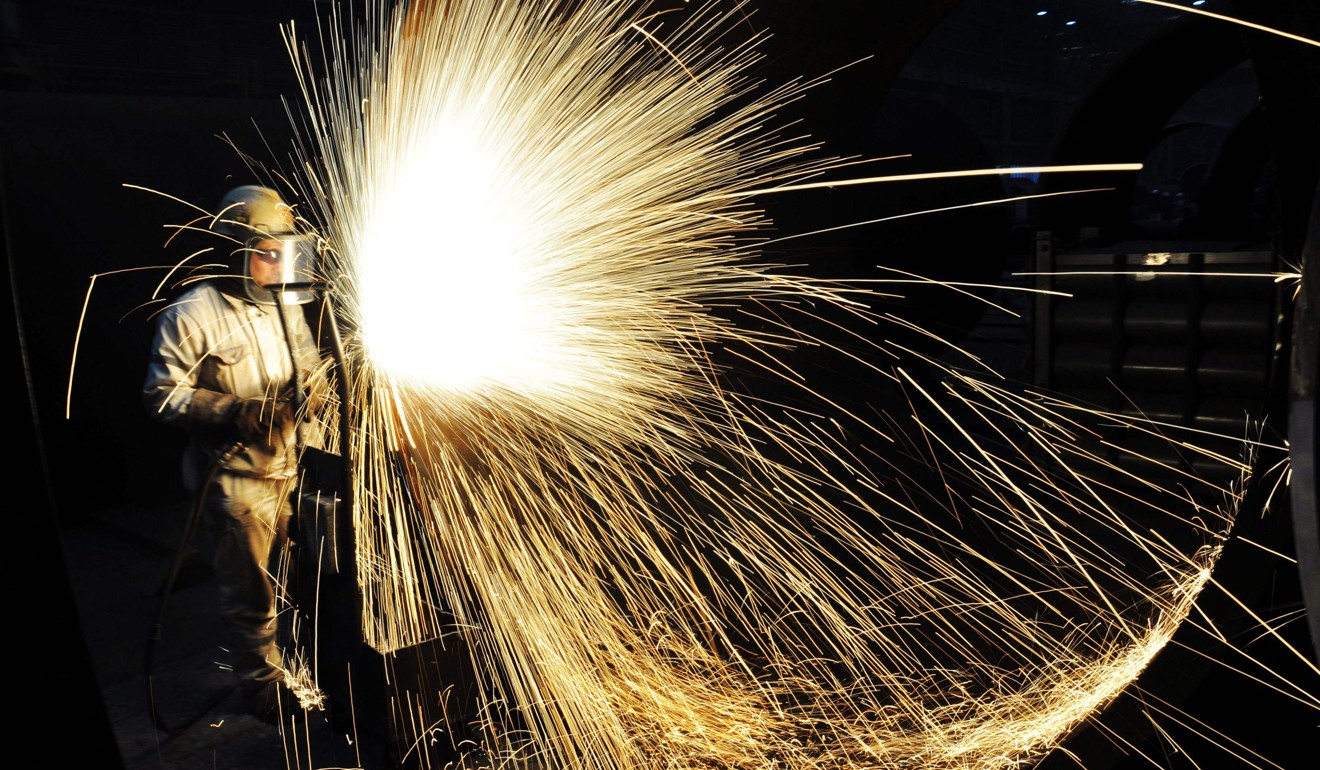 A worker cutting steel in Qingdao in China's eastern Shandong province. Photo: AFP