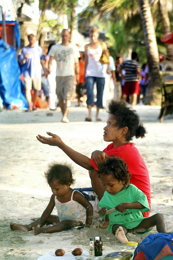 Members of the indigenous Ati ethnic group beg on the street. Picture: AFP