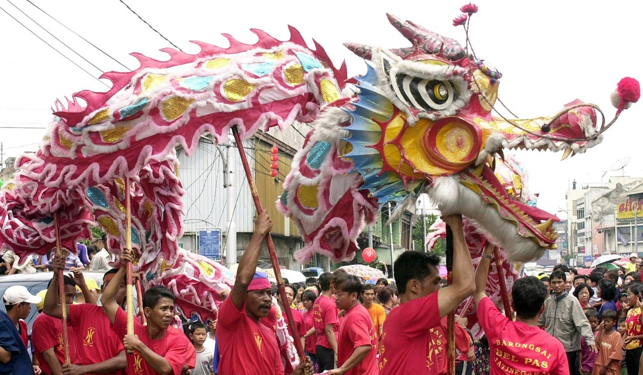 Chinese Indonesians perform a dragon dance in Jakarta. For decades, the former dictator Suharto had banned expressions of Chinese culture. Photo: AFP