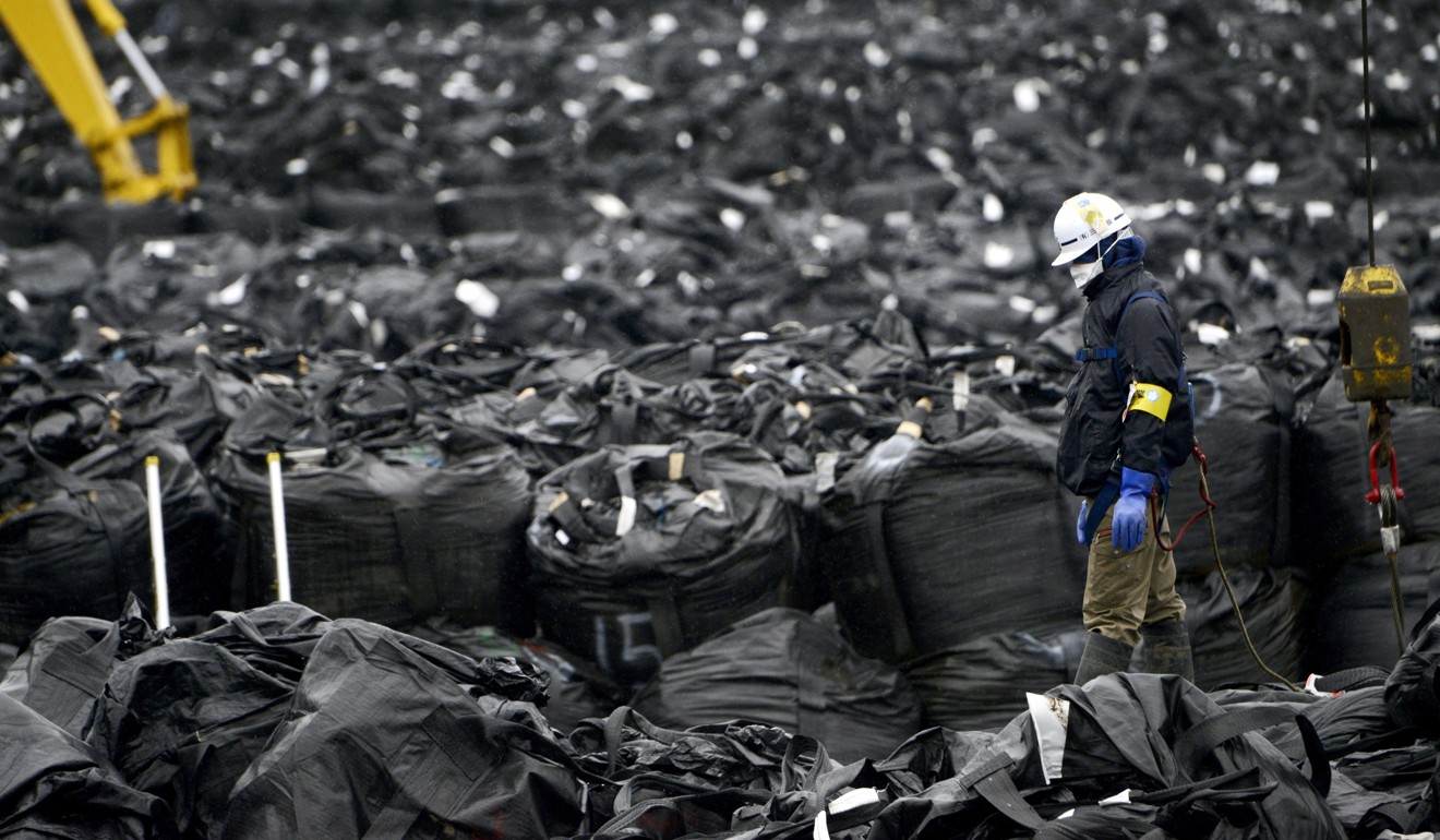 Radioactive soil and debris in black vinyl bags continues to pile up in Tomioka, a town adjacent to the crippled Fukushima Daiichi nuclear plant. Photo: Kyodo