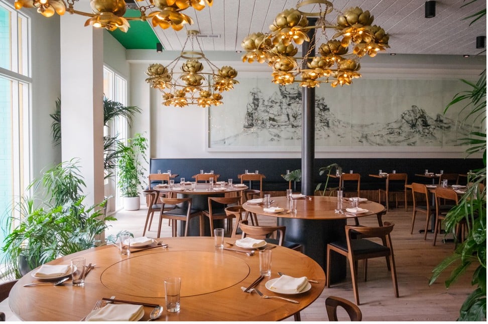 The dining room at Mister Jiu’s features some vintage gold chandeliers. Photo: Michael Weber