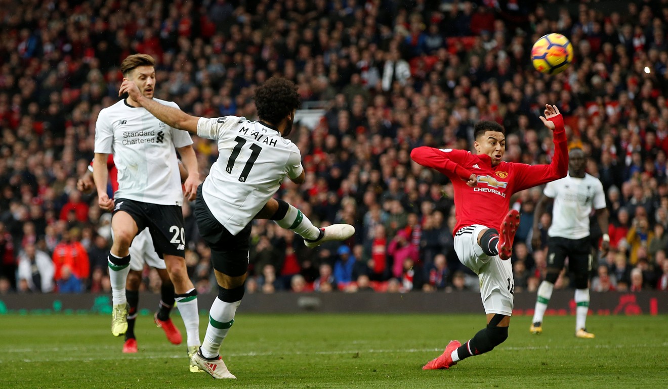 Liverpool's Mohamed Salah shoots at goal as Manchester United's Jesse Lingard attempts to block. Photo: Reuters