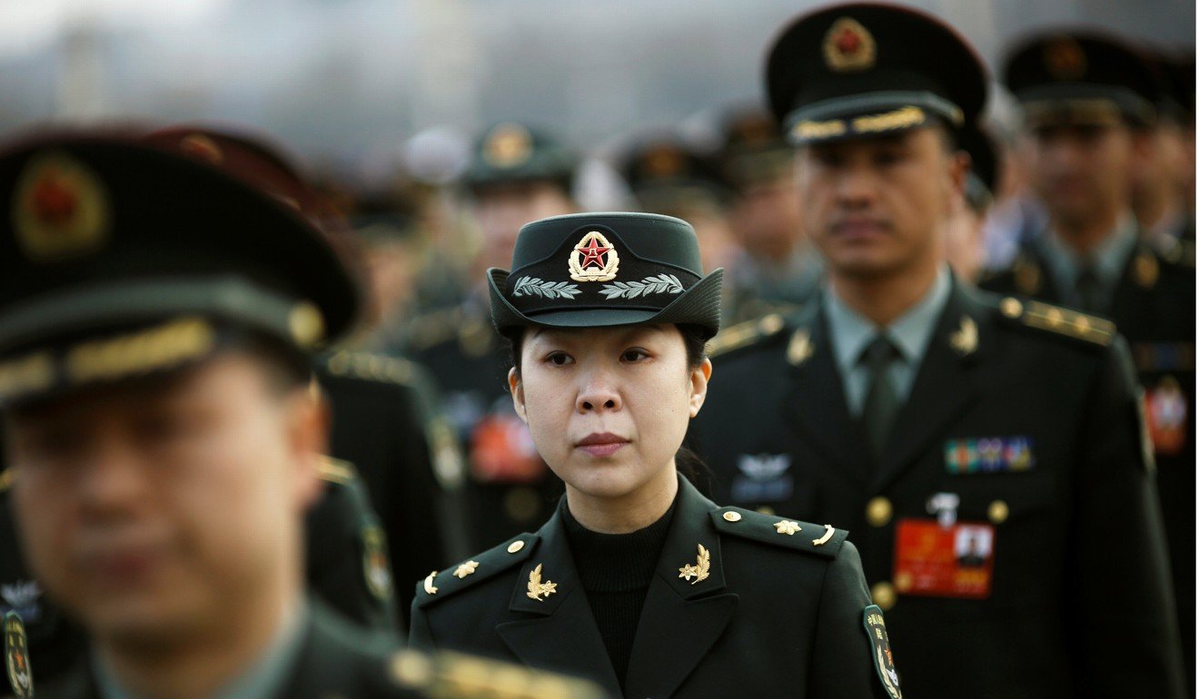 Military delegates arrive for the opening session of the National People's Congress (NPC) in Beijing on March 5, 2018. Photo: Reuters