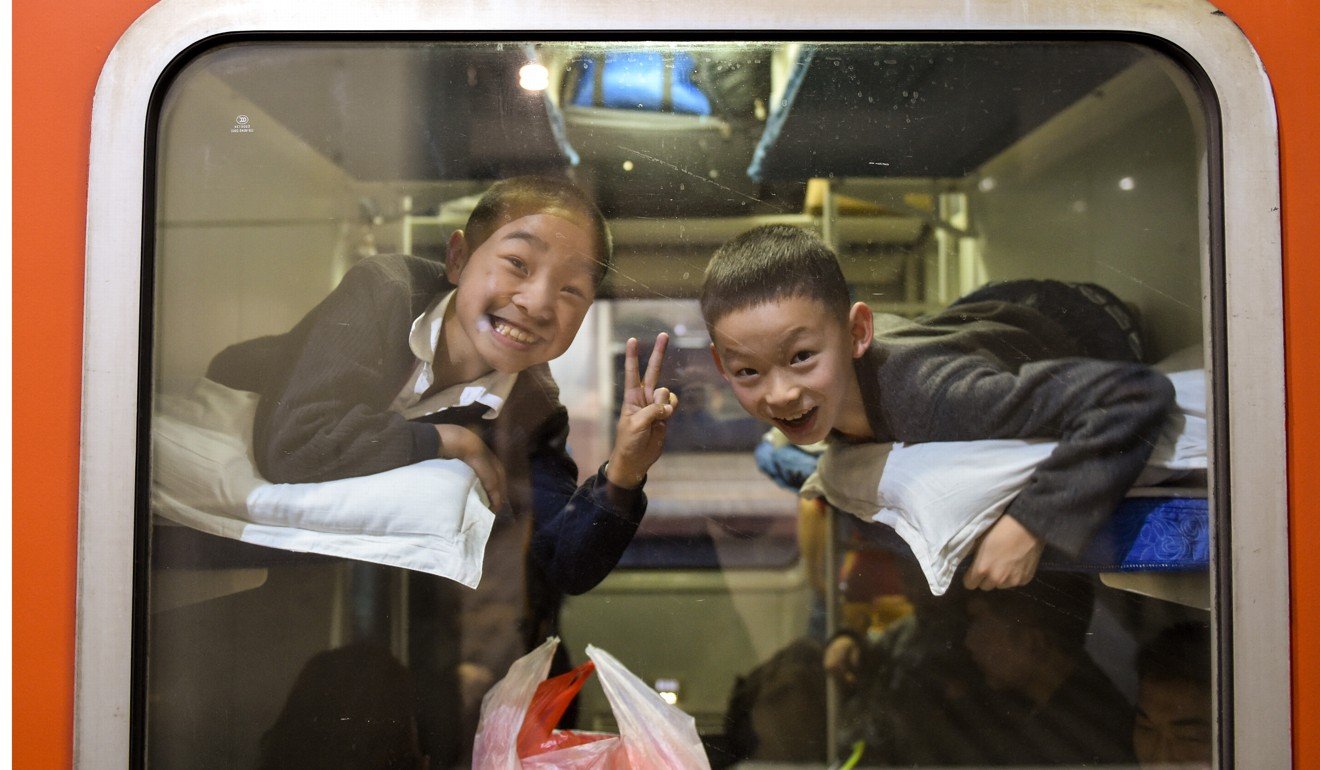 Children on a train at Shenzhen Railway Station. Photo: Xinhua